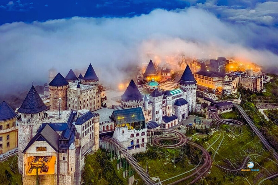 Fantasy castle complex in Ba Na Hills Da Nang surrounded by clouds – Auasia Travel